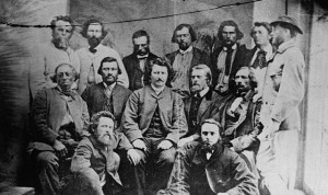 A photograph of a group of men, standing or sitting in position