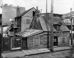 Black and white photo of an old wooden house