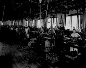 A factory full of women operating machinery