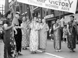 Women carry a sign reading "Chinese Women Ass'n"