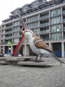 A large bird statue in a public square