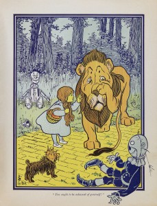 Cartoon of little girl Dorothy comforting the crying Cowardly Lion on the Yellow Brick Road
