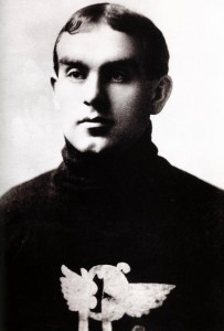 Photo of a young man in a dark turtleneck sweater