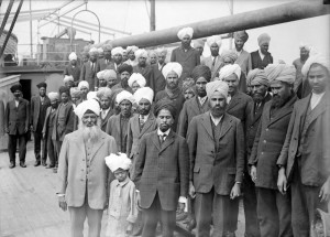 A group of men in suits and turbans