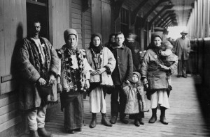 Photo of a group of adults and children standing together