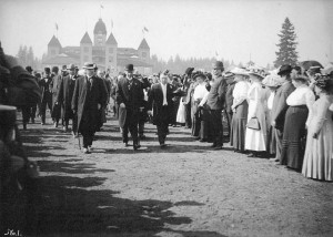 Laurier and others pass a crowd of onlookers