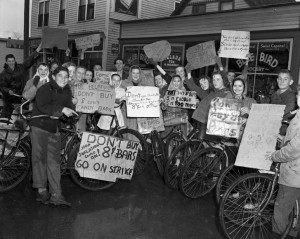 A group of children hold signs reading "Don't buy 8 cent candy bars"