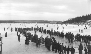 A crowd on ice, gathered around a curling rink