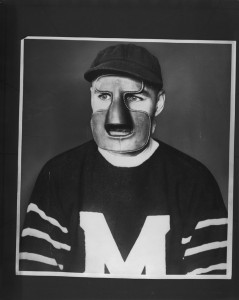 A man in an early goalie mask