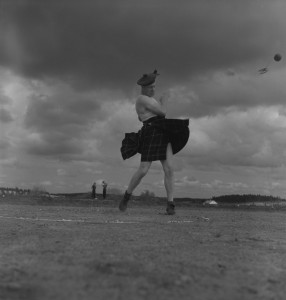 A kilted stone-thrower in action.