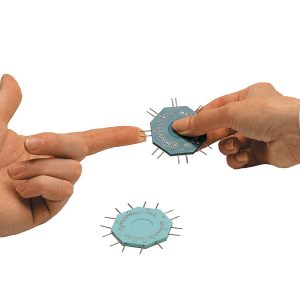 A clinician is applying two prongs of a Disk-Criminator device to the tip of a patient's first finger