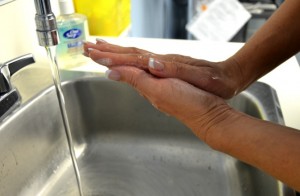 Lather hands with soap and water