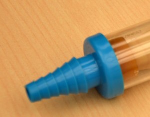 Blue end connects to chest tube; other end may be left open to air or attach to a small drainage bag
