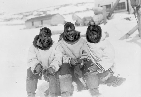 Three Inuit men after a hunt