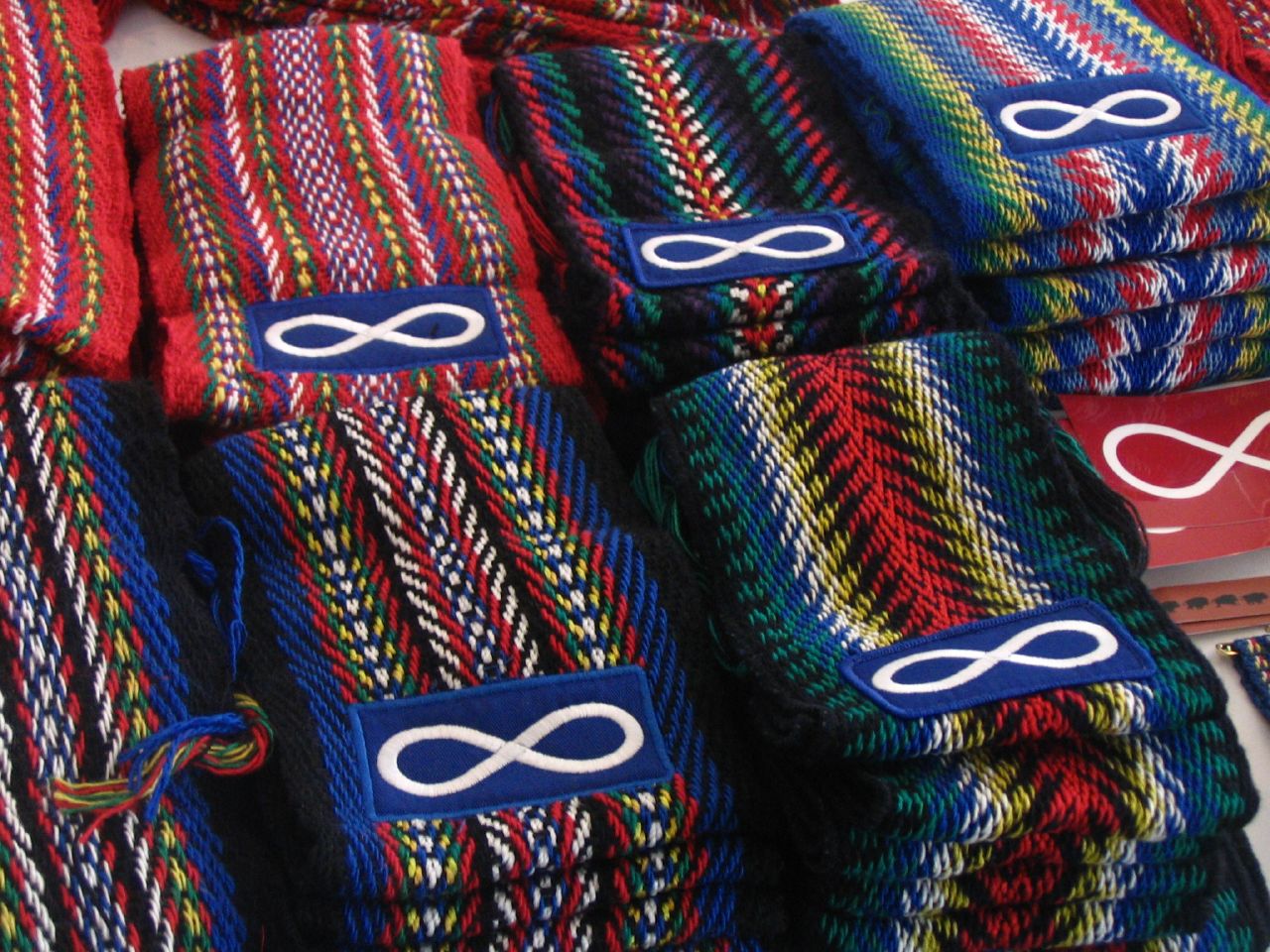Métis Sashes. These bright finger-woven sashes are worn either around the waist or over the shoulder. The complex patterns represent the complex history of the Métis. Photo by: Chris Corrigan
