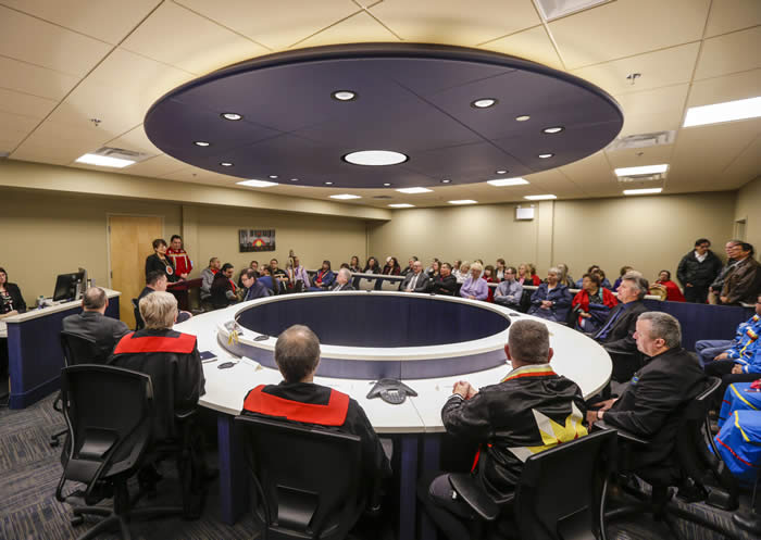 Gladue Courthouse in Wagmatcook First Nation. Members of the court team and First Nations leaders gather in the new courtroom in Wagmatcook on the first day of operations (April 4, 2018) Credits to: Provincial Courts of Nova Scotia/Wagmatcook First Nation. Used with permission from: Wagmatcook First Nation [173]