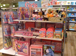 shelves in a toy store filled with pink toys