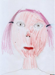 Childs drawing of a girl's face.
