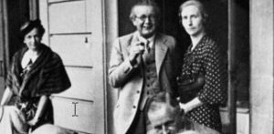 Black & white photo of Jean Piaget standing beside a woman.