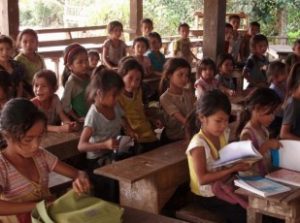 Children studying in an open air classroom. 