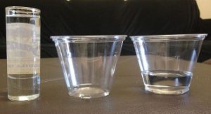 3 clear plastic containers- onw tall and skinny and the other two short and wide. 