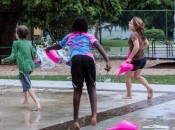 Children playing in the water at a park.