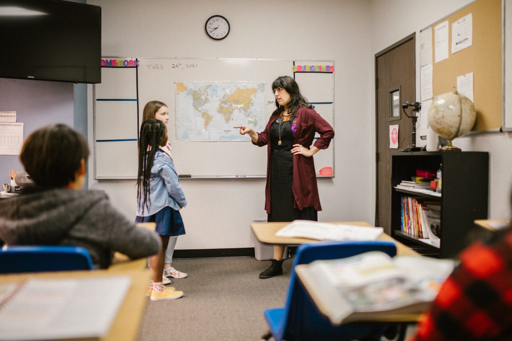 Two Girls Getting Scolded by Their Teacher