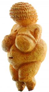 Figure 1-1 shows a stone sculpture of a faceless female form, with exaggerated breasts and hips.