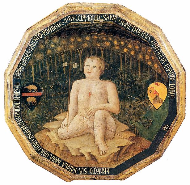 Figure 1-3 A twelve-sided dish, made from painted wood, with gold edges. In the center, is a replication of a late-gothic, early renaissance-style painting of the birth of St. John the Baptist. The baby is sitting in a forest or garden. Since this would have been given as a present to wealthy new parents, the coat of arms for each parent appears to the left and right of the baby.