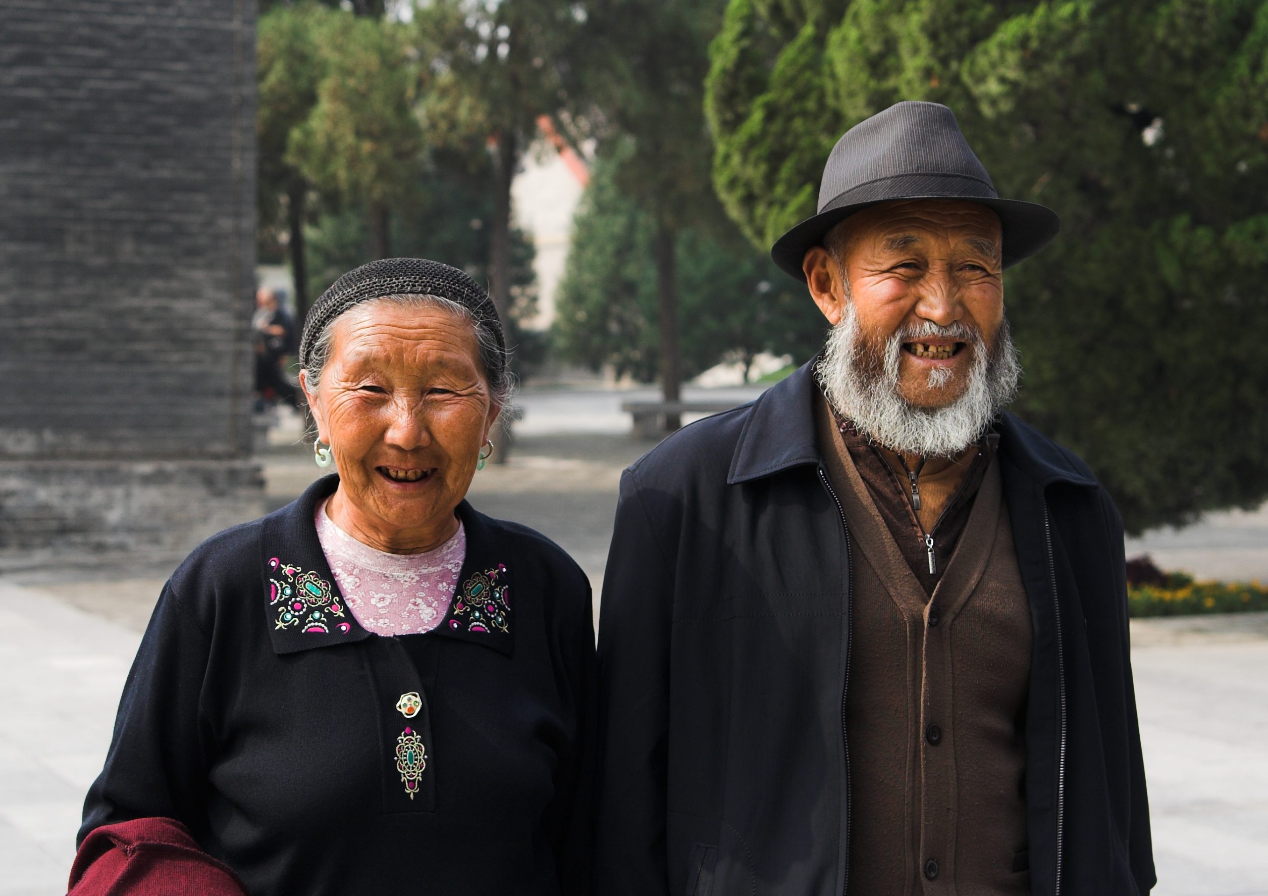 old happy couple picture taken in one of Budda's temples; this old man with his wife came to worship their gods.