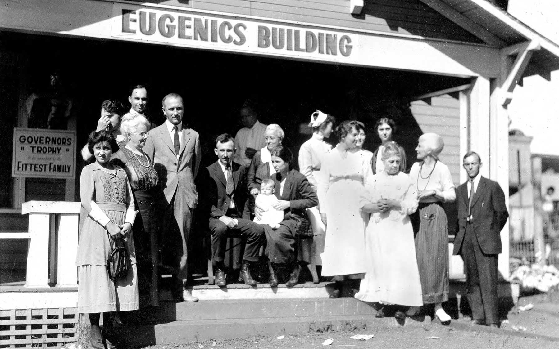 Winners of a Fitter Family contest stand outside the Eugenics Building at the Kansas Free Fair in Topeka, KS, where families are registered for the contests. Credits to: American Philosophical Society. (US: Fair Use; CC BY 2.0)