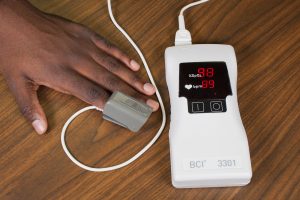 Pulse oximeter with a spring-loaded finger probe