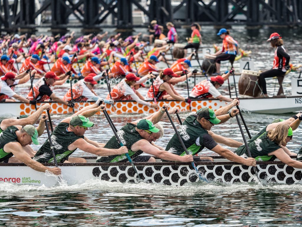 several dragon boat racing teams in competition