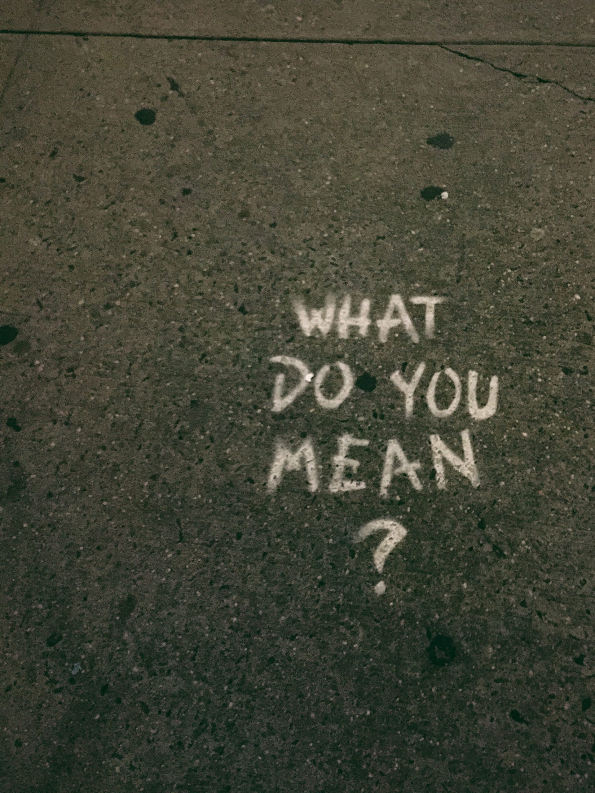 What do you mean? is written on the pavement