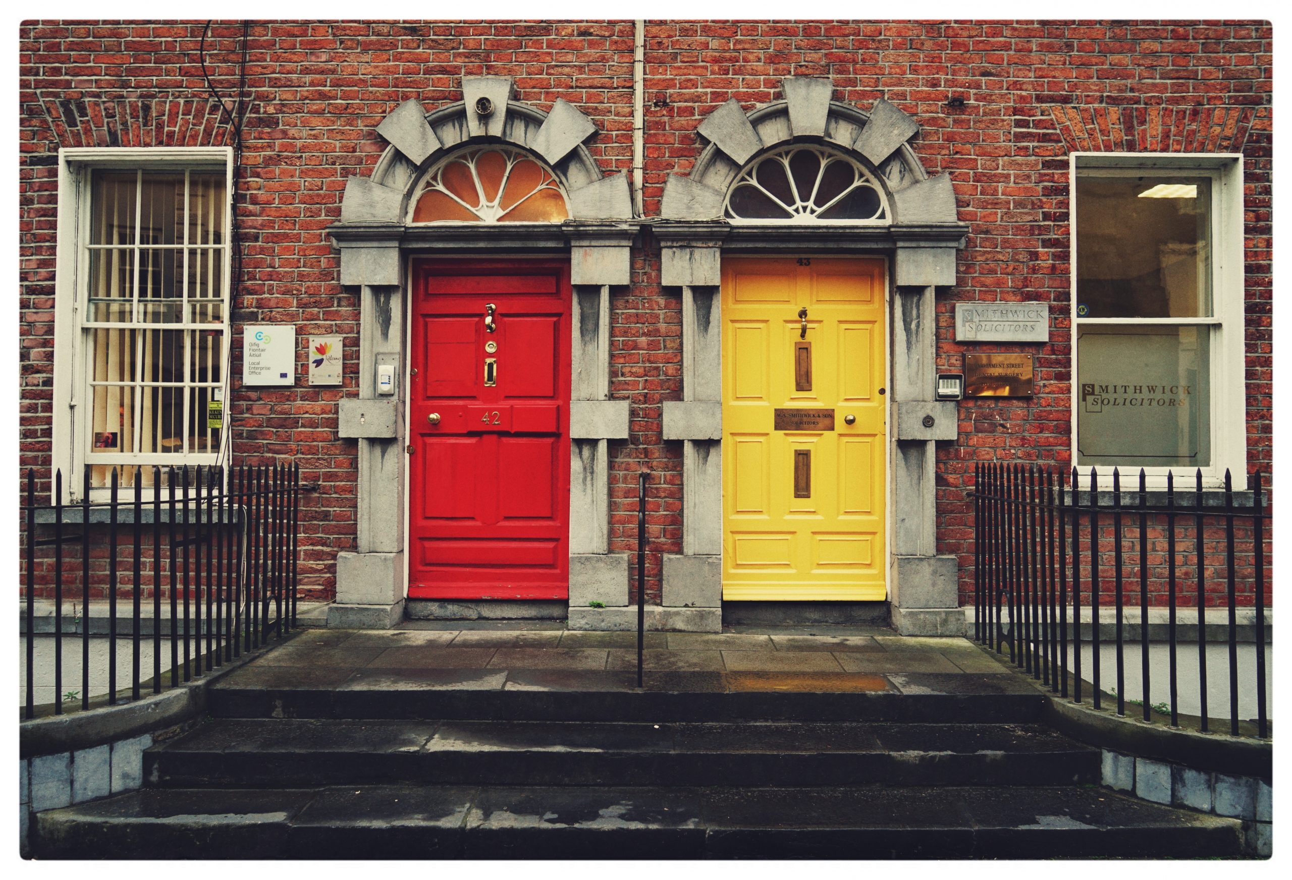 Red and yellow doors side by side