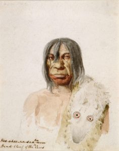 A rough sketch and watercolour of an Indigenous man looking out at the viewer; there is a faint suggestion of his bare torso and an animal hide over his shoulder, but his craggy face and chin-length gray hair are detailed.