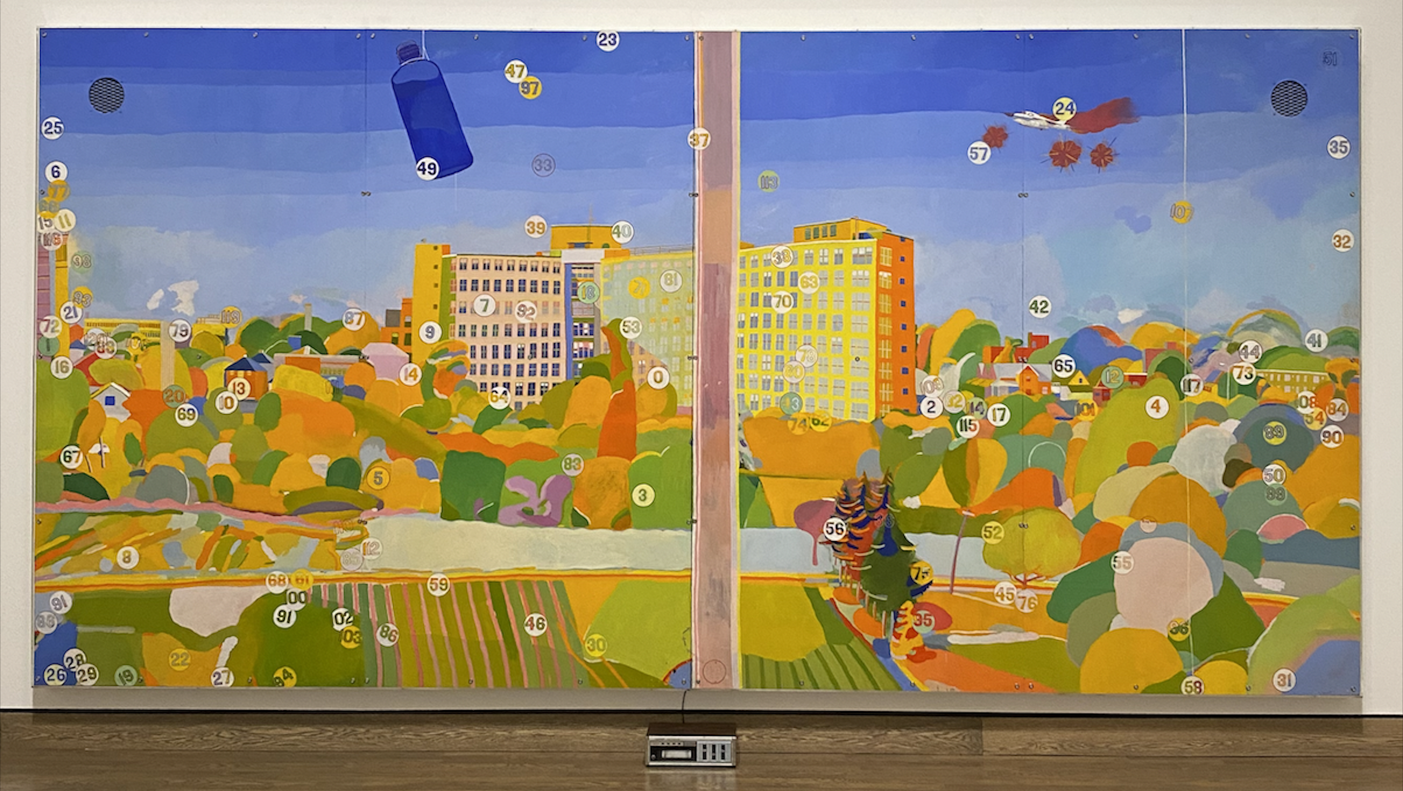 Multimedia work of a brightly coloured, stylized view out of a window. The canvas is divided in two by a vertical pink strip, as if it were two windowpanes. Outside, fields and trees, roads, and a building are represented by coloured shapes. A blue water bottle hangs at the top of the left-hand pane as if hanging from a window frame. Small white dots are scattered across the screen, each bearing a number from one to 120.