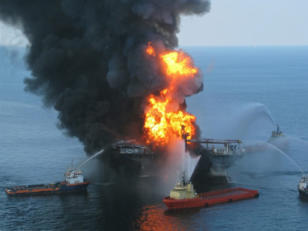 Photograph of boats fighting the fire from an explosion at the Deepwater Horizon drilling rig.