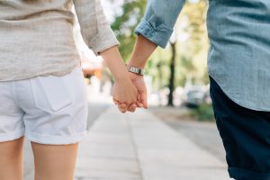 Two people holding hands.