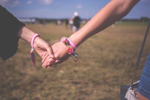 Two people holding hands.