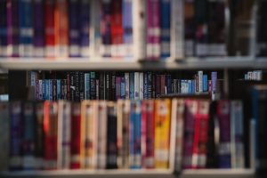 Photo of library shelves with books.