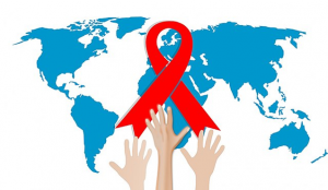 Three hands reaching for a red HIV/AIDS ribbon, overlaid over the world map.