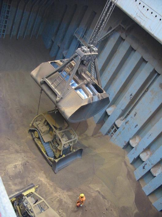 Bull dozer loaded into the hold of a bulk carrier before unloading of cargo.