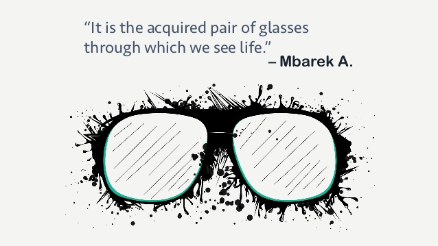 "It is the acquired pair of glasses through which we see life" a quote by Mbarek A. Drawing of glasses with ink splots