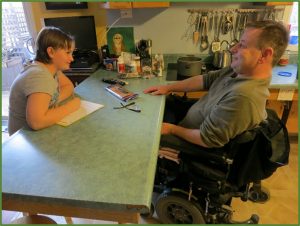 Bill Meyerman, who has a Spinal Cord Injury, in conversation with a student.