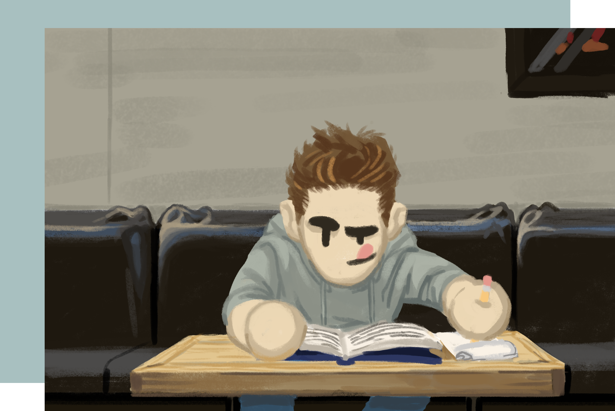 Guy on couch with book taking notes