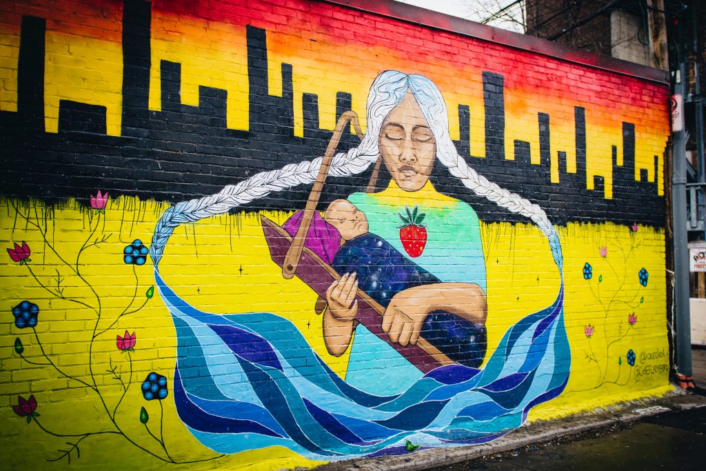 graffiti of indigenous woman and baby