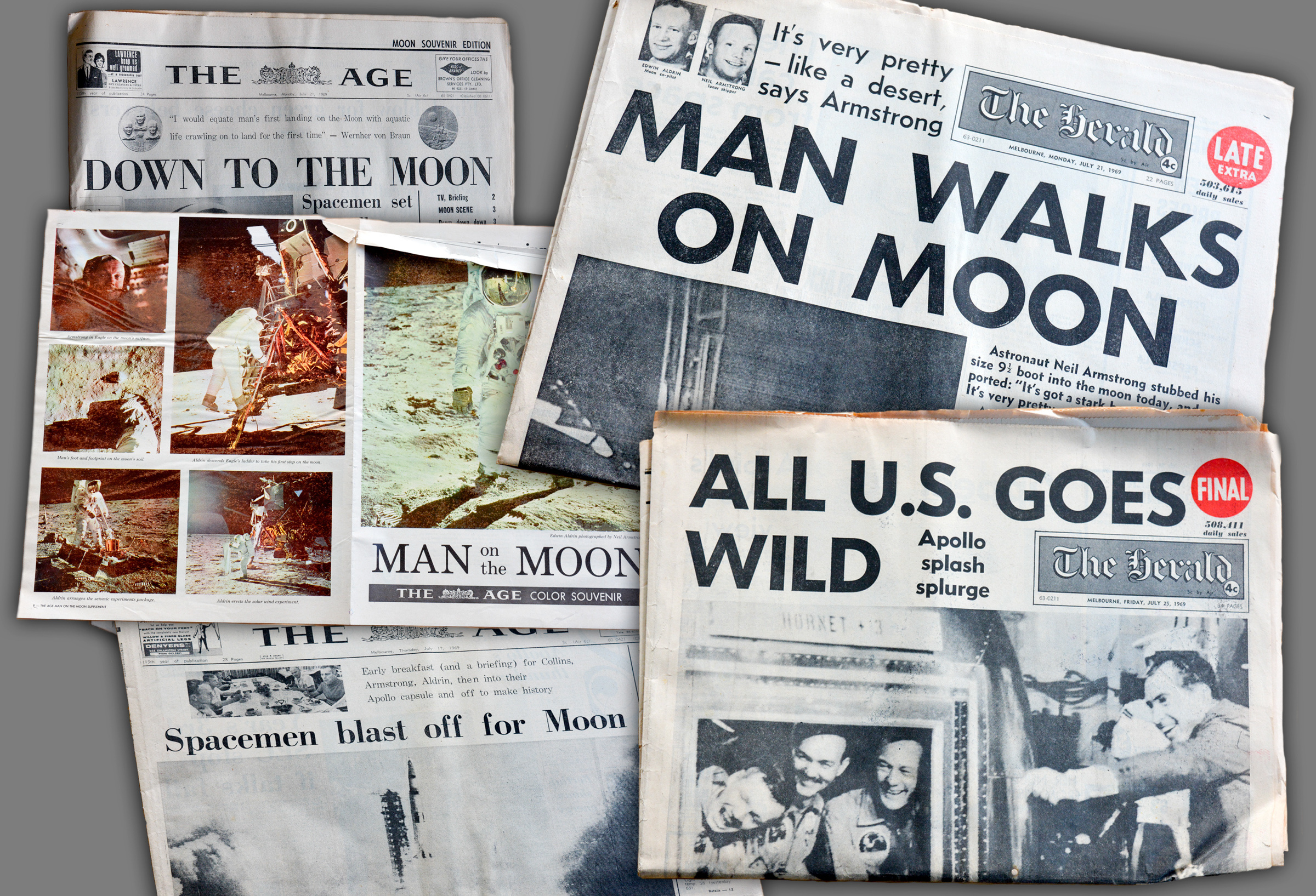 A collection of newspaper front pages bear headlines explaining when the first man walked on the moon.