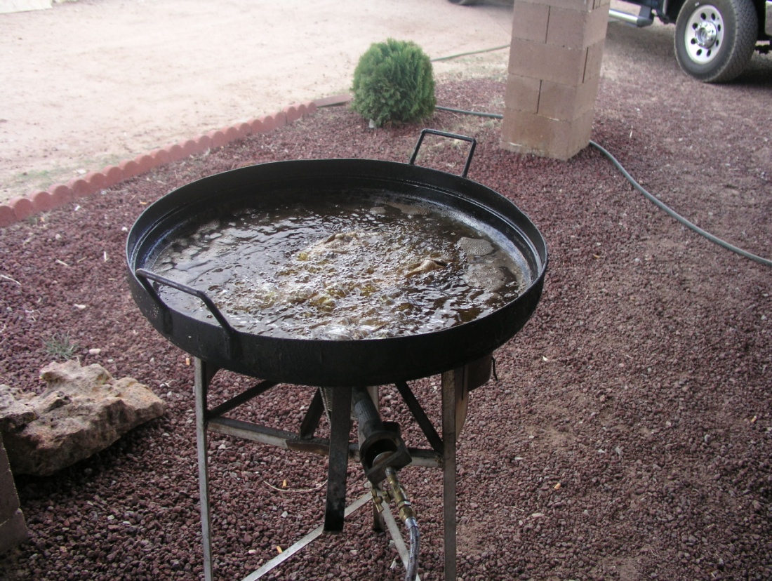 an outdoor deep-frying pan filled with hot oil