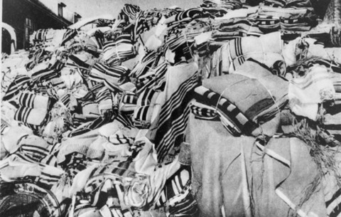 A large pile of prayer shawls (tallesim, tallitot), confiscated from arriving prisoners, are stored in one of the warehouses in Auschwitz.